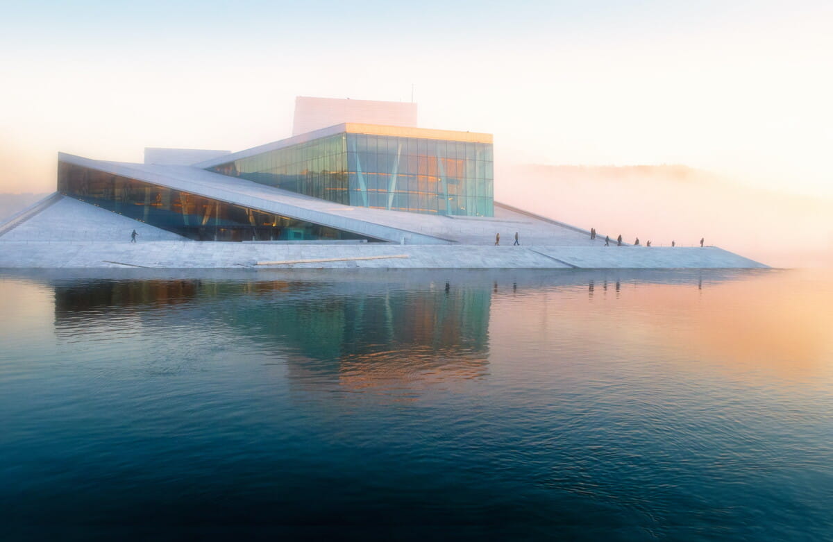 gray building near body of water under white sky.jpg