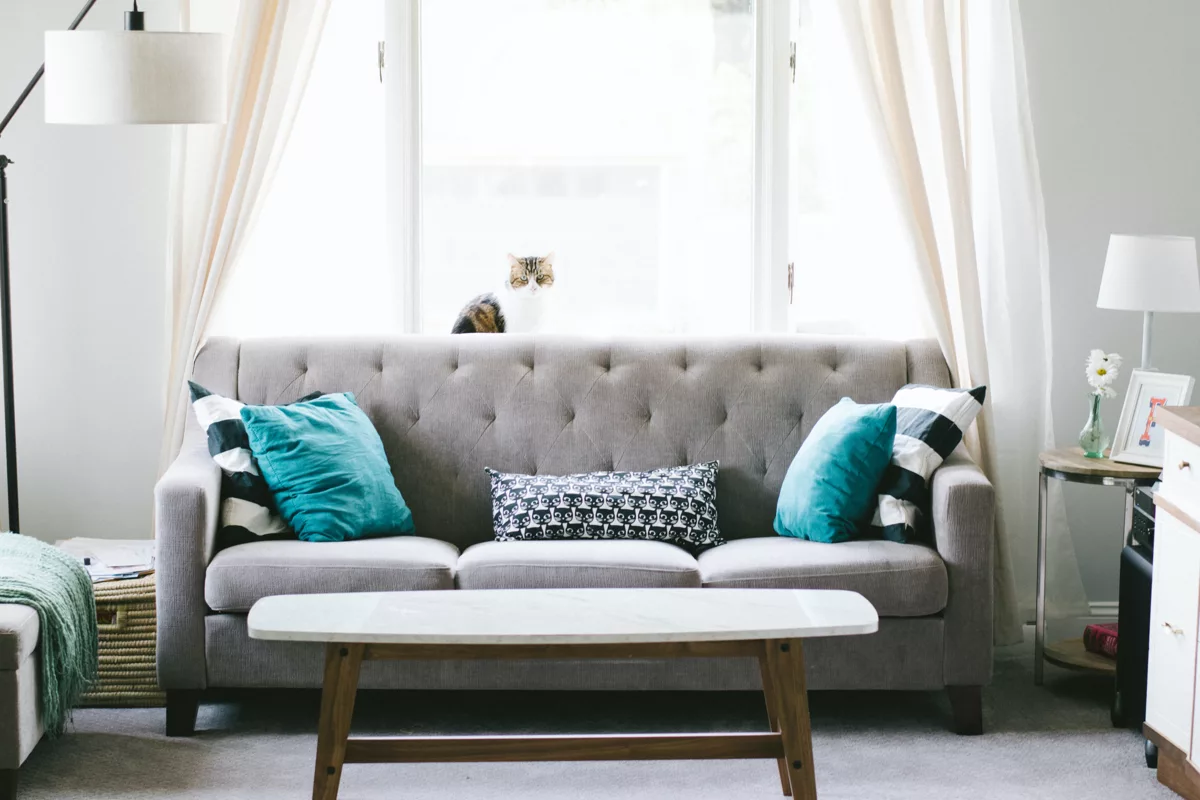 brown and white wooden table beside sofa chair.jpg