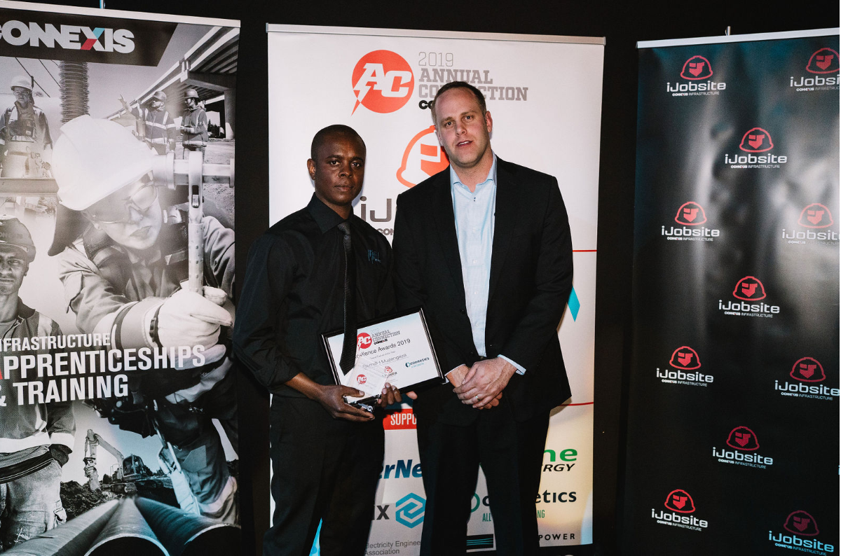 Overall Trainee of the Year Bernard Muzengeza Wel Networks Waikato with Daniel Woollaston Connetics Wellington Manager.PNG