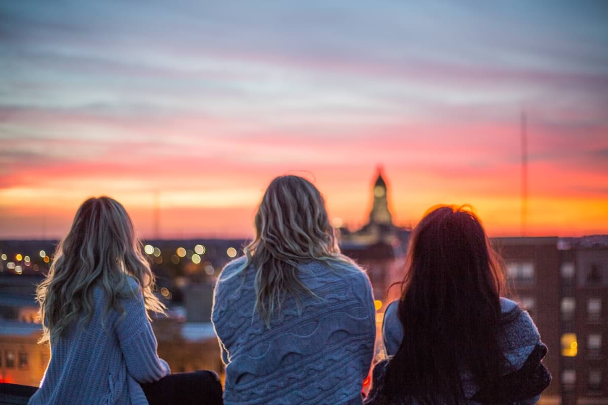photo of three woman facing backward staring at horizon.jpg