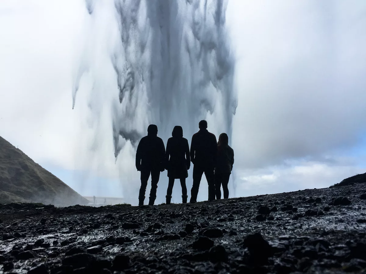 four person's looking at geyser.jpg