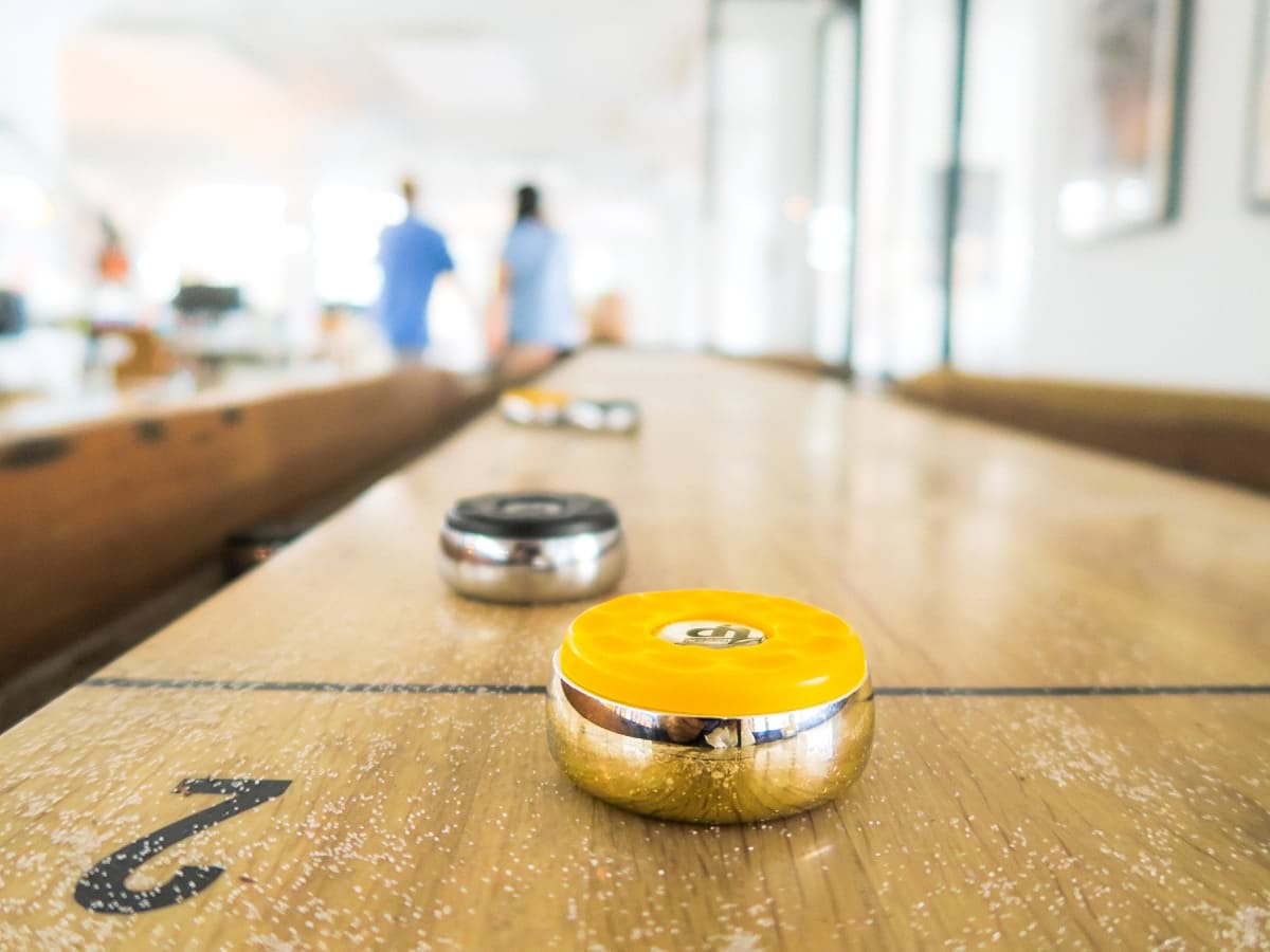 two black and yellow trinkets on table.jpg